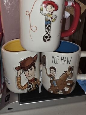 Rae Dunn White Cowboy Character Mugs with Yellow, Blue, and Red Interiors